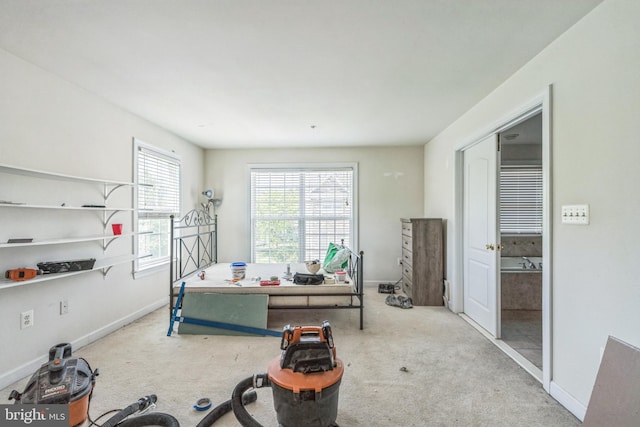 interior space with carpet flooring and baseboards