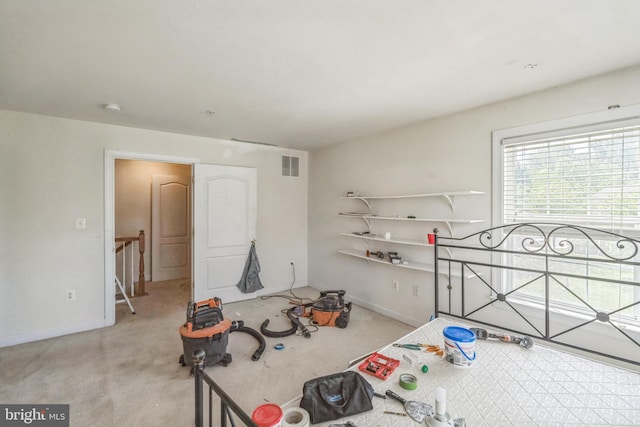 unfurnished bedroom featuring visible vents, baseboards, and light carpet