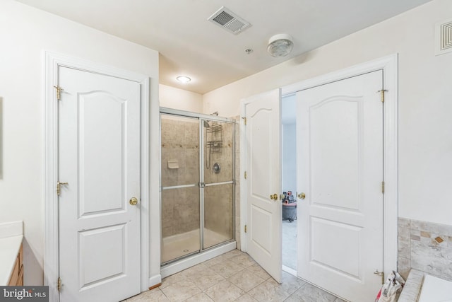 full bathroom featuring visible vents, a shower stall, and tile patterned flooring