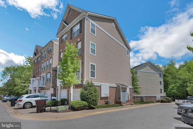 view of property with uncovered parking