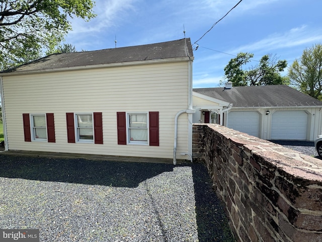 view of side of property featuring a garage
