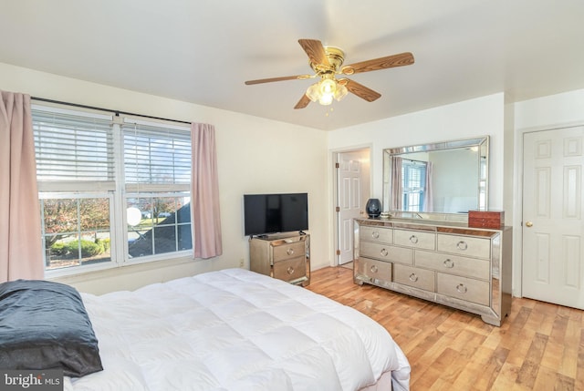 bedroom featuring a ceiling fan and light wood finished floors