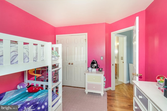 bedroom featuring a closet and wood finished floors