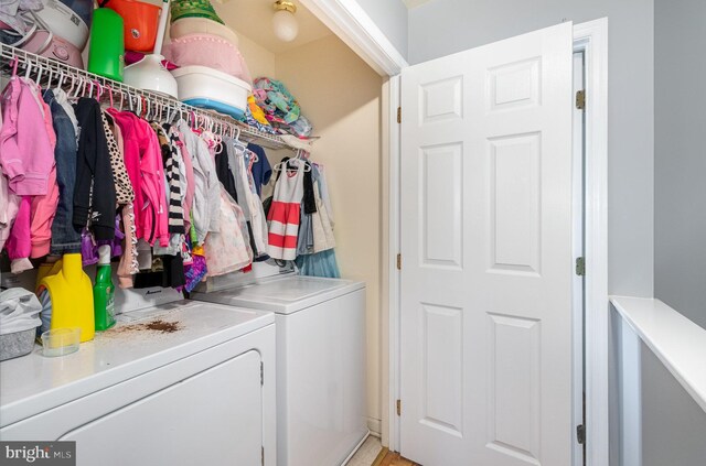 washroom featuring laundry area and washer and dryer