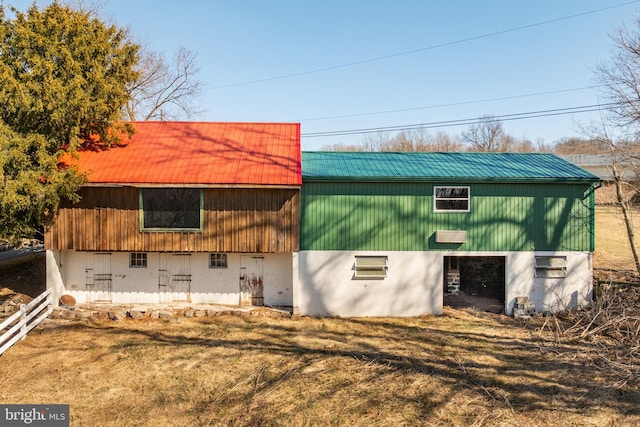 exterior space featuring metal roof