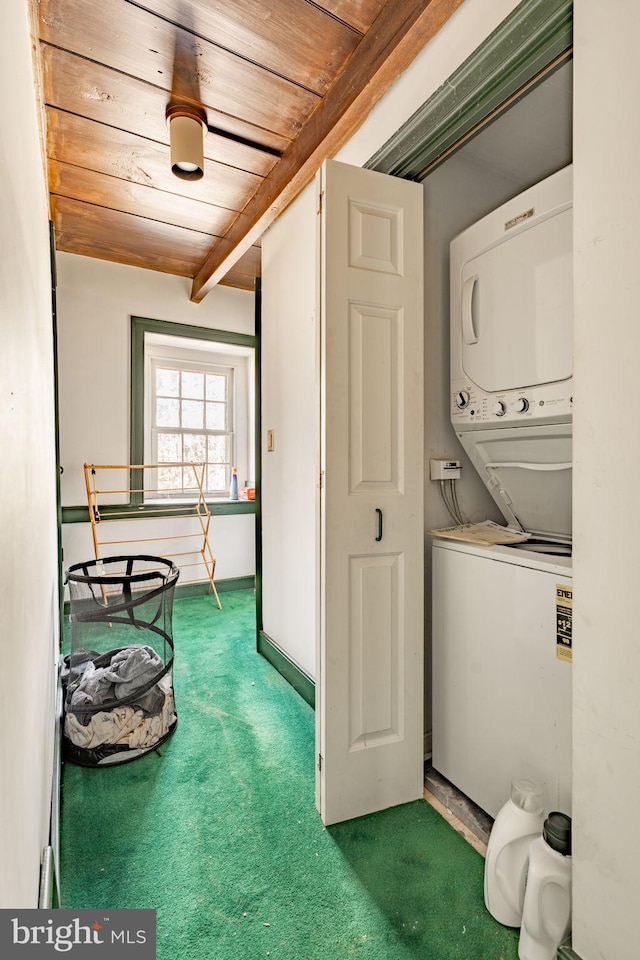 washroom featuring laundry area, carpet, stacked washing maching and dryer, and wooden ceiling