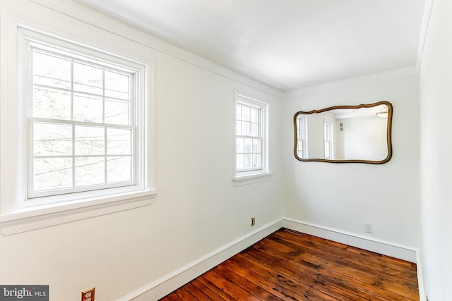 136 Carpenter St Unit A, Philadelphia, PA 19147 - spare room featuring crown molding, baseboards, dark wood finished floors, and visible vents