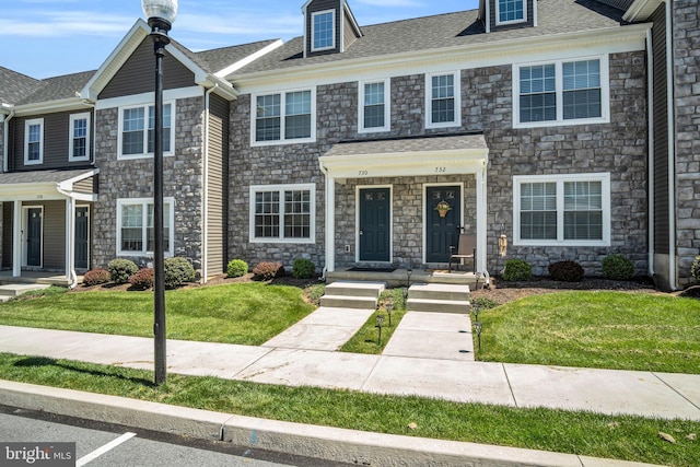 730 Farmwood Ln, Lebanon, PA 17042 - townhome / multi-family property with stone siding, a front lawn, and roof with shingles