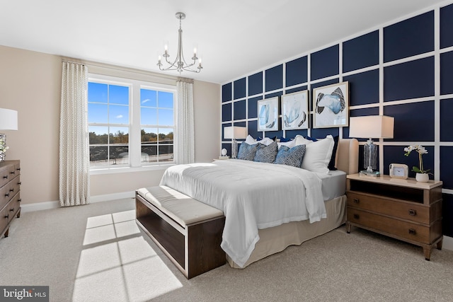 bedroom featuring an inviting chandelier, baseboards, and carpet