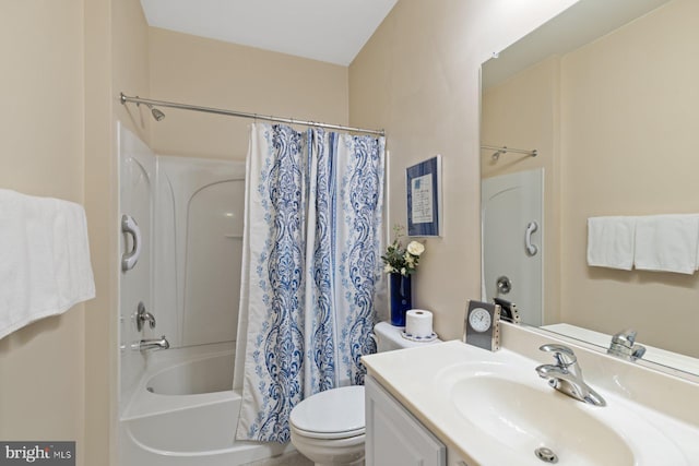 full bath with toilet, vanity, and shower / bath combo