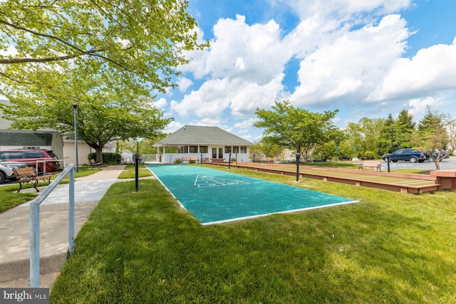 surrounding community with a yard and shuffleboard