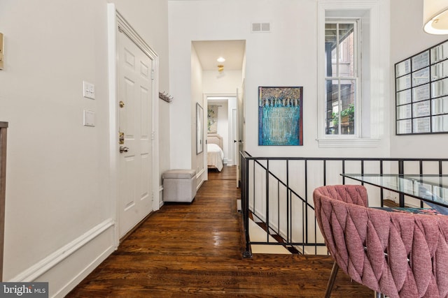 2308 Spruce St Unit 2310A, Philadelphia, PA 19103 - hall featuring baseboards, an upstairs landing, a towering ceiling, visible vents, and dark wood-style floors