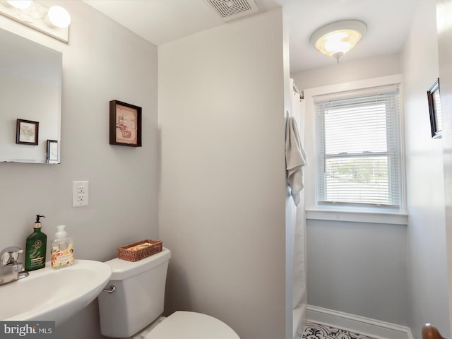 1691 Wakeman Mill Rd, Front Royal, VA 22630 - full bath with a sink, toilet, a shower with shower curtain, and visible vents