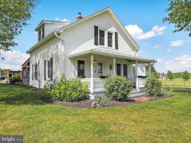 1691 Wakeman Mill Rd, Front Royal, VA 22630 - view of front facade featuring a front lawn, a porch, and a chimney