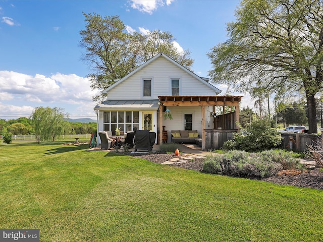 1691 Wakeman Mill Rd, Front Royal, VA 22630 - back of property featuring a lawn, fence, an outdoor hangout area, a patio area, and a sunroom