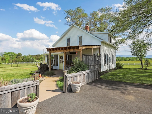 1691 Wakeman Mill Rd, Front Royal, VA 22630 - view of front of home featuring fence, a chimney, and a front yard