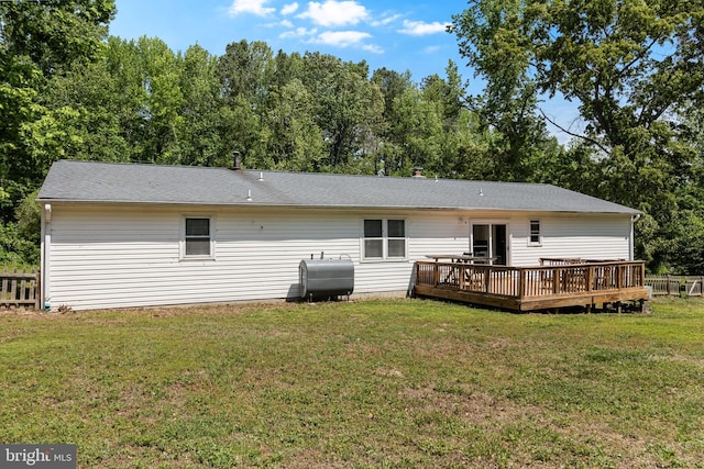 8105 Vacchiano Dr, Port Tobacco, MD 20677 - back of property with heating fuel, a deck, and a lawn