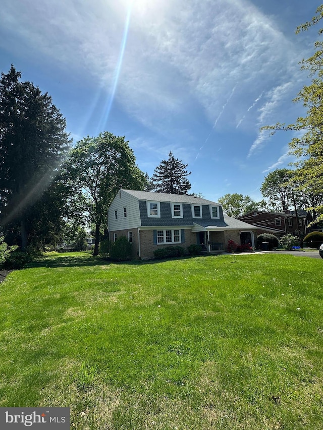 755 Shawmont Ave, Philadelphia, PA 19128 - colonial inspired home with a front lawn, brick siding, and a gambrel roof