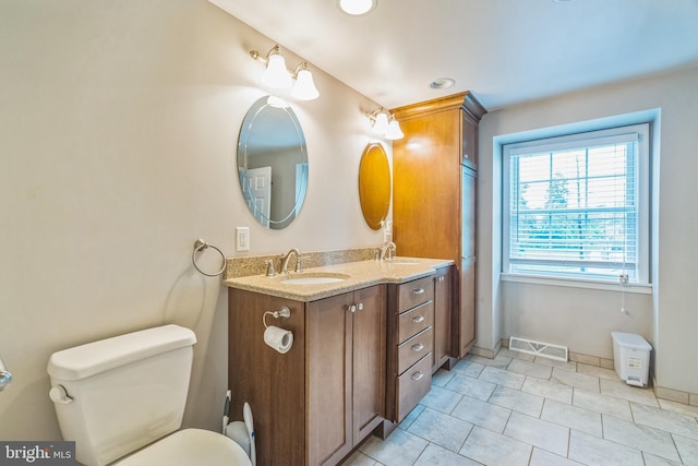 755 Shawmont Ave, Philadelphia, PA 19128 - full bath with double vanity, toilet, tile patterned floors, recessed lighting, and baseboards
