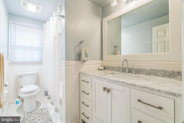 755 Shawmont Ave, Philadelphia, PA 19128 - full bathroom featuring vanity, wainscoting, toilet, and a shower with shower curtain