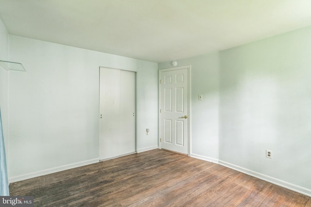 755 Shawmont Ave, Philadelphia, PA 19128 - unfurnished bedroom with wood finished floors, a closet, and baseboards