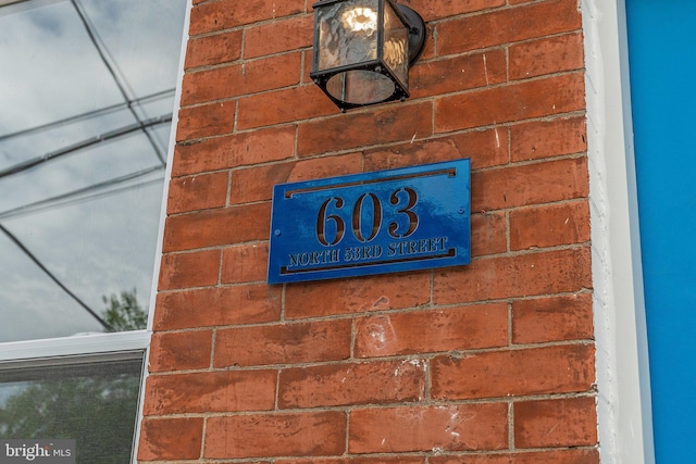 exterior details featuring brick siding