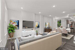 living room with baseboards, recessed lighting, and wood finished floors