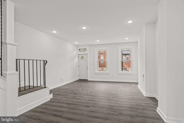 entrance foyer featuring baseboards, dark wood-style flooring, stairway, and recessed lighting