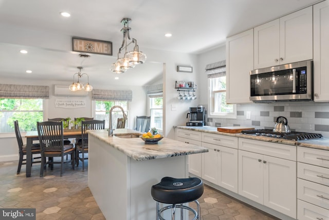 111 Linden Ave, Pasadena, MD 21122 - kitchen with a sink, appliances with stainless steel finishes, and a healthy amount of sunlight