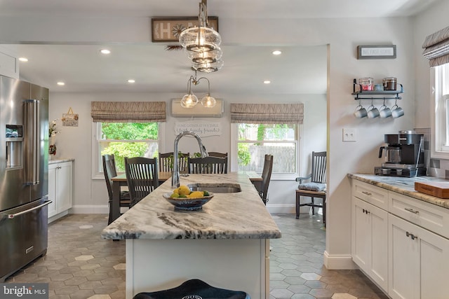 111 Linden Ave, Pasadena, MD 21122 - kitchen with a sink, recessed lighting, high quality fridge, and a wealth of natural light