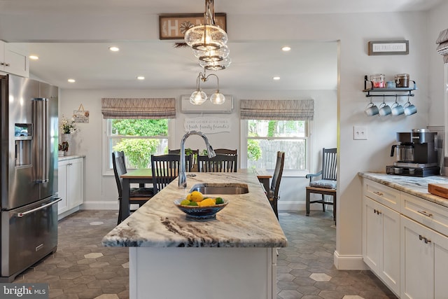 111 Linden Ave, Pasadena, MD 21122 - kitchen with white cabinets, recessed lighting, a healthy amount of sunlight, and high quality fridge