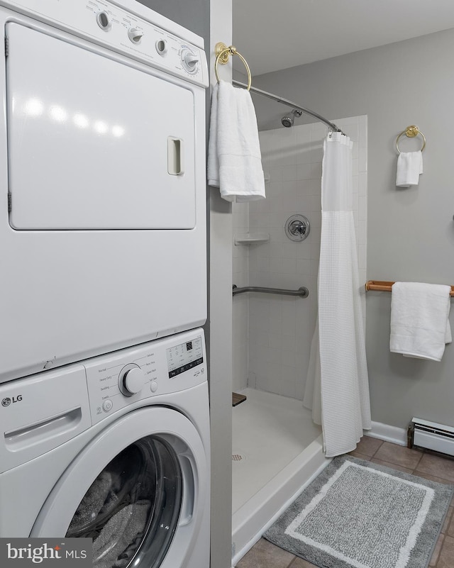 111 Linden Ave, Pasadena, MD 21122 - laundry room with tile patterned floors, laundry area, and stacked washer / drying machine