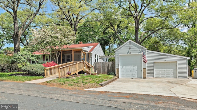 111 Linden Ave, Pasadena, MD 21122 - view of front of house with fence, an outbuilding, and a detached garage
