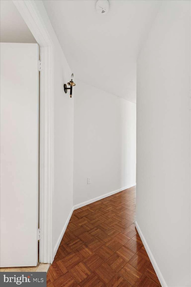 hallway featuring baseboards