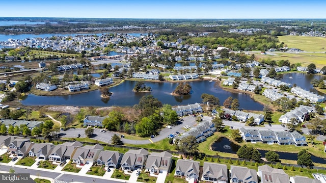 aerial view featuring a residential view and a water view