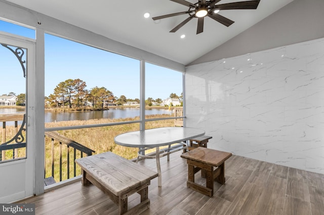 sunroom featuring a ceiling fan, recessed lighting, wood finished floors, and lofted ceiling