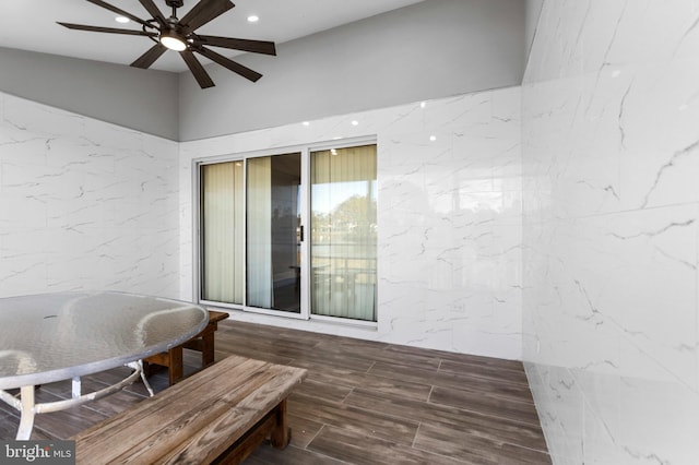 exterior space featuring ceiling fan