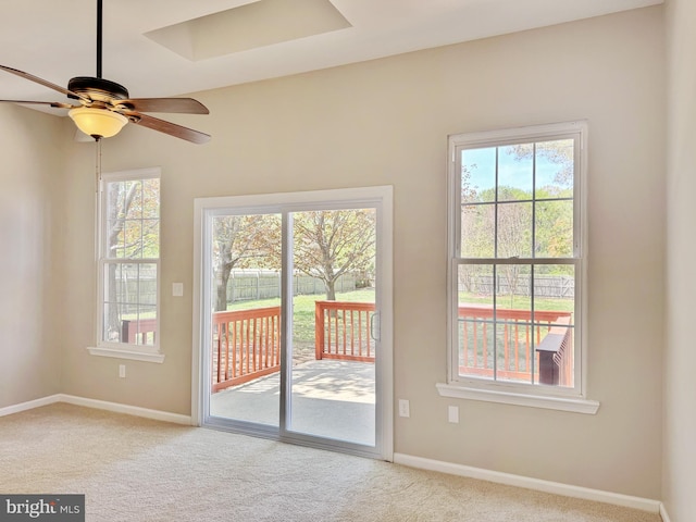 entryway with carpet floors, ceiling fan, and a wealth of natural light