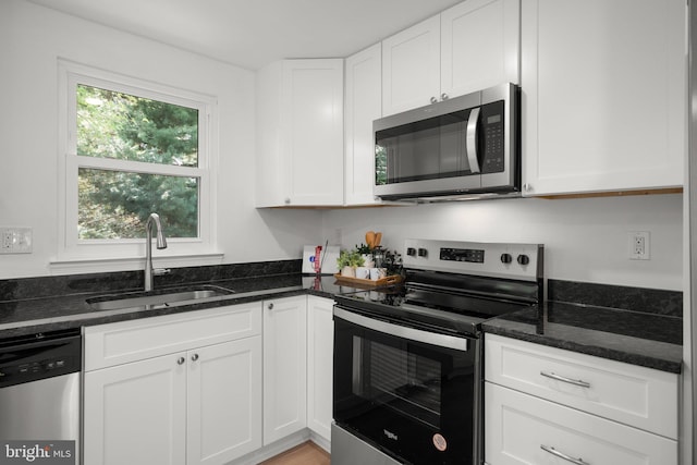 3604 Ripplingbrook Ct, Bowie, MD 20721 - kitchen with a sink, dark stone counters, white cabinets, and stainless steel appliances