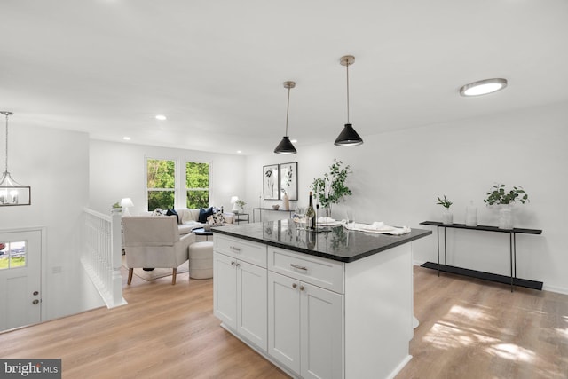 3604 Ripplingbrook Ct, Bowie, MD 20721 - kitchen featuring a kitchen island, decorative light fixtures, light wood finished floors, an inviting chandelier, and white cabinetry
