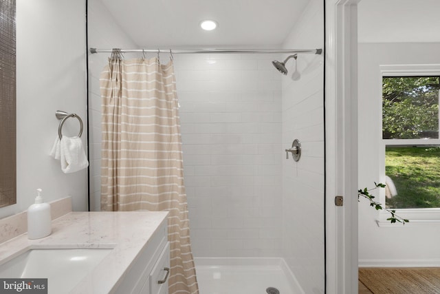 full bath with vanity, recessed lighting, and a stall shower