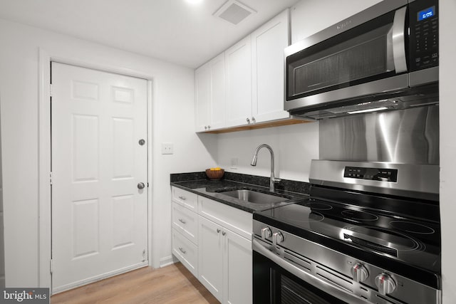 3604 Ripplingbrook Ct, Bowie, MD 20721 - kitchen with white cabinetry, appliances with stainless steel finishes, a sink, and visible vents