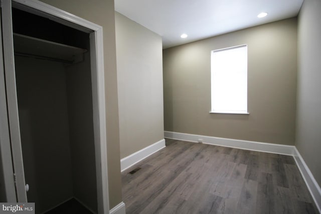 unfurnished bedroom featuring recessed lighting, baseboards, and wood finished floors