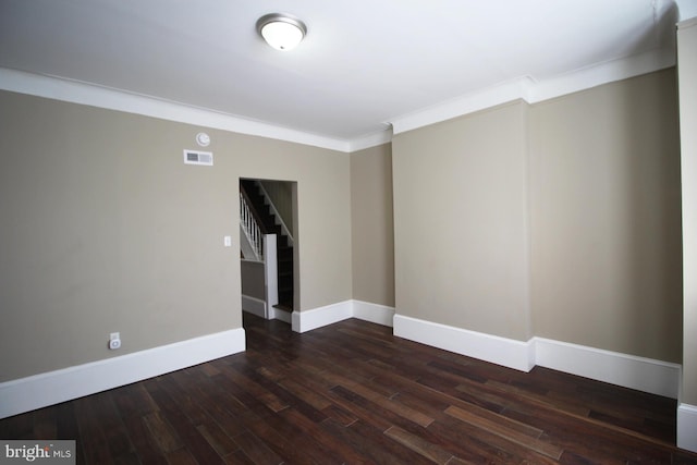 unfurnished room featuring stairs, visible vents, crown molding, and wood finished floors