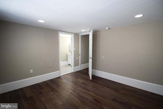 interior space featuring baseboards, recessed lighting, and dark wood-style floors