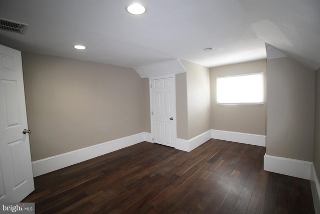 bonus room featuring baseboards, recessed lighting, visible vents, and dark wood-style floors