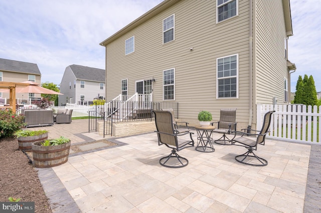 109 Manila Pl, Stephenson, VA 22656 - rear view of property with a patio area, fence, and an outdoor living space