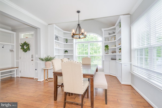 109 Manila Pl, Stephenson, VA 22656 - dining space with a chandelier, light wood-type flooring, built in features, crown molding, and vaulted ceiling