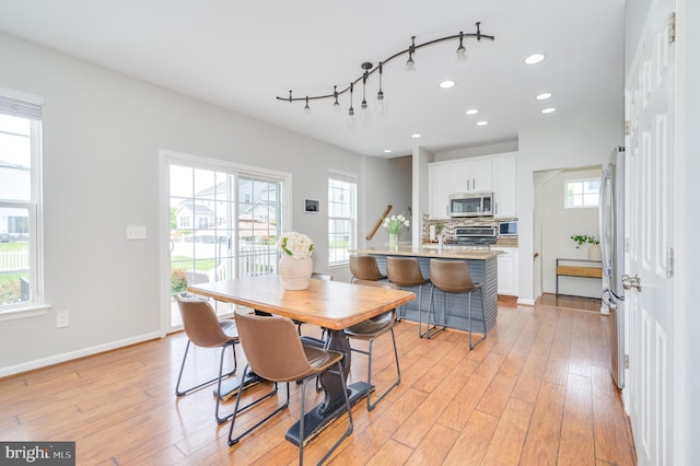 109 Manila Pl, Stephenson, VA 22656 - dining area with recessed lighting, healthy amount of natural light, light wood-type flooring, baseboards, and track lighting