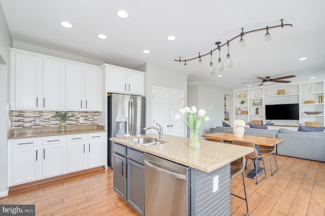 109 Manila Pl, Stephenson, VA 22656 - kitchen with appliances with stainless steel finishes, a sink, light wood finished floors, ceiling fan, and recessed lighting